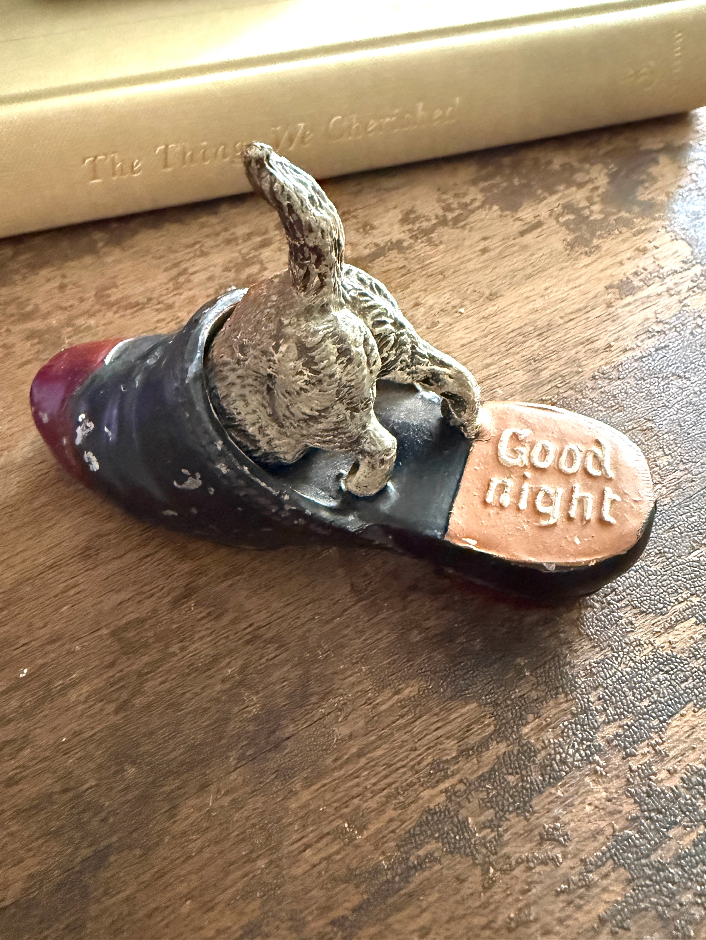 Dog in slipper figurine
